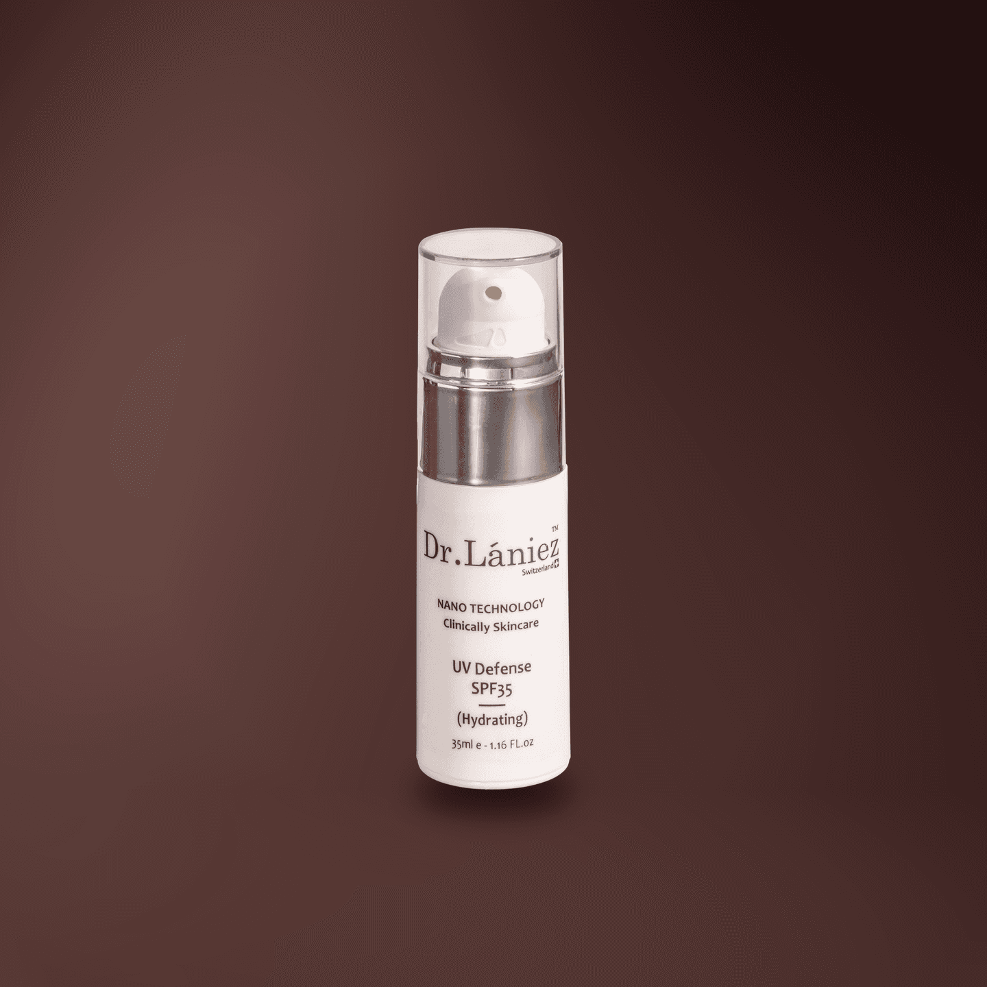 White pump bottle of UV Defence SPF 35 Hydrating sunscreen, 35 ml, lit on a warm plum studio backdrop.